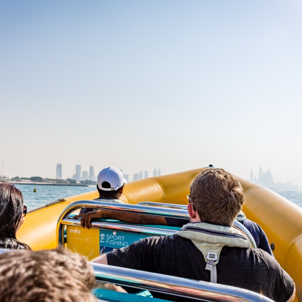 a couple of people sitting at a beach