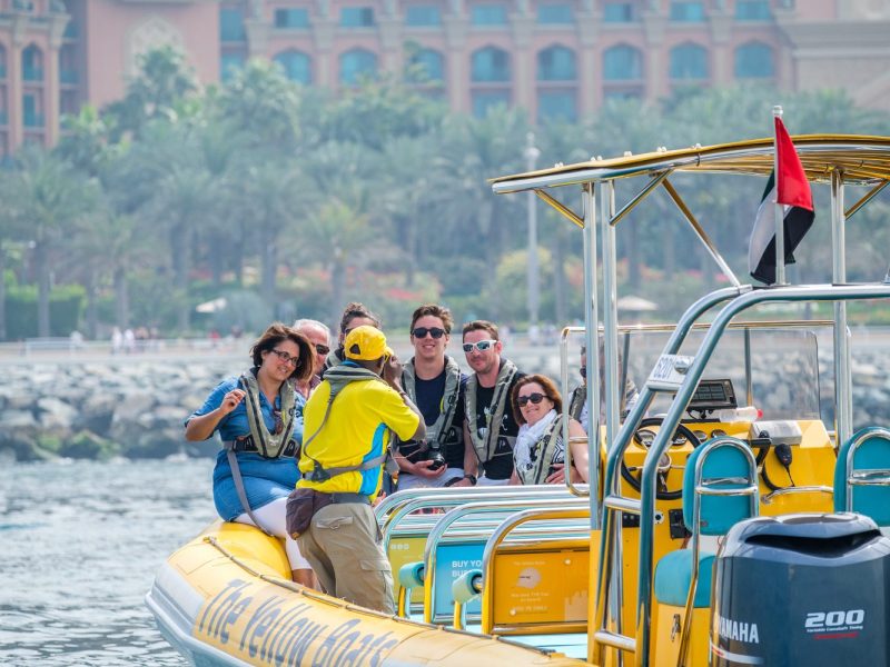 a group of people riding on the back of a boat