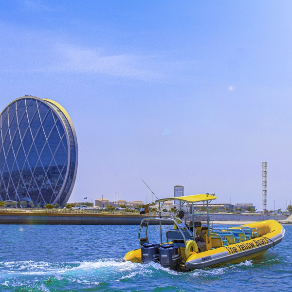 a close up of a boat next to a body of water
