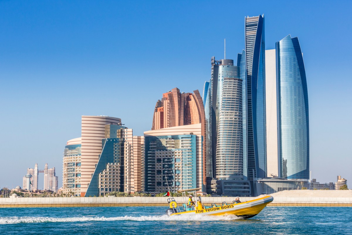 a large body of water with a city in the background