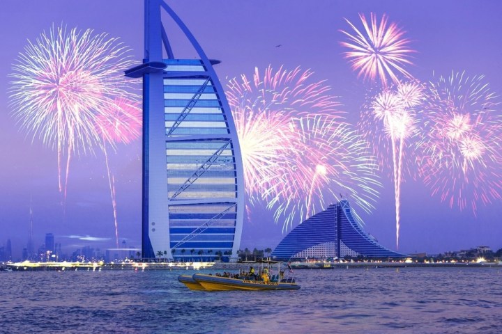 fireworks in the sky over a body of water